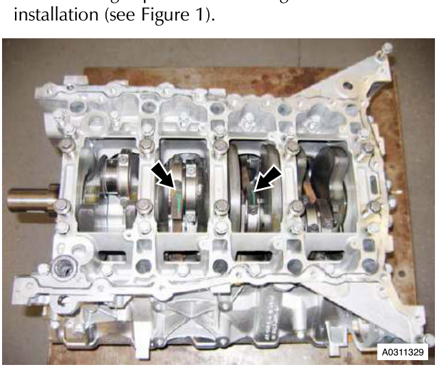 Engine block with arrows pointing to bearing caps