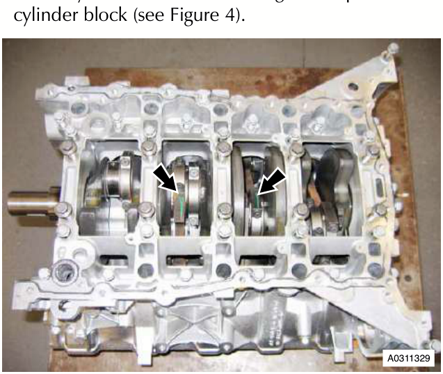 Engine block with arrows pointing to the bedplate