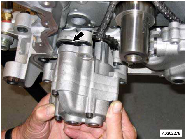 Engine block showing multiplug connected to engine electric coolant temperature sensor with arrow pointing to it