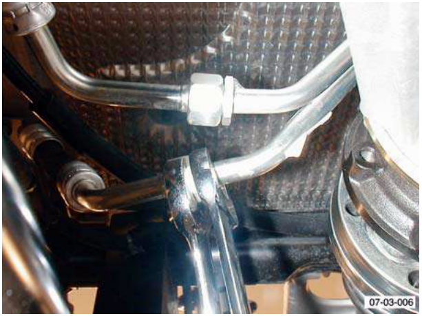 Close-up view of pipes connected to an oil cooler matrix, labeled F3.