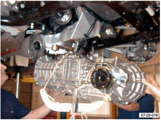 Transaxle being lowered with a jack