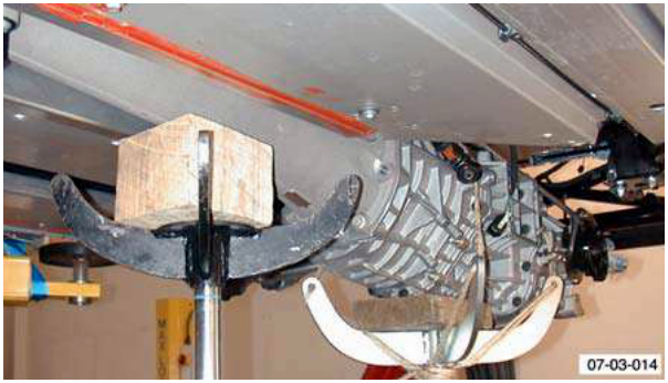 Transmission jack positioned under torque tube
