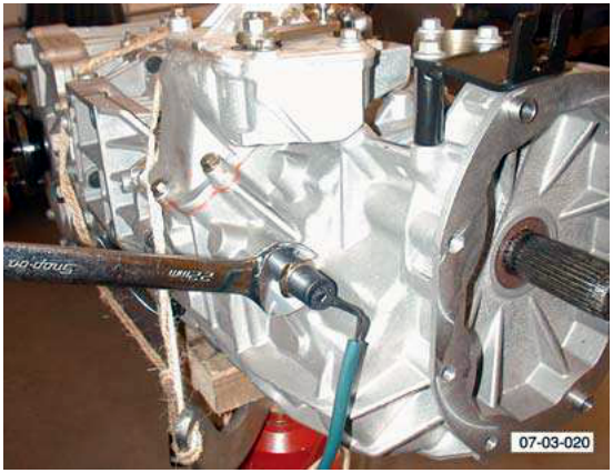 transaxle with wrench on bolt