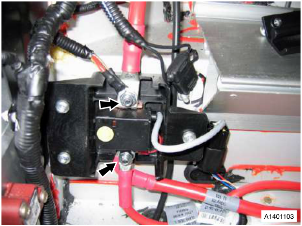 View of the battery disconnect switch with arrows pointing to the cable terminals and mounting points
