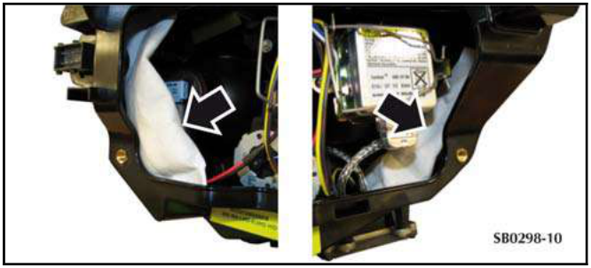 Close-up of headlamp interior showing two white silica gel bags inserted