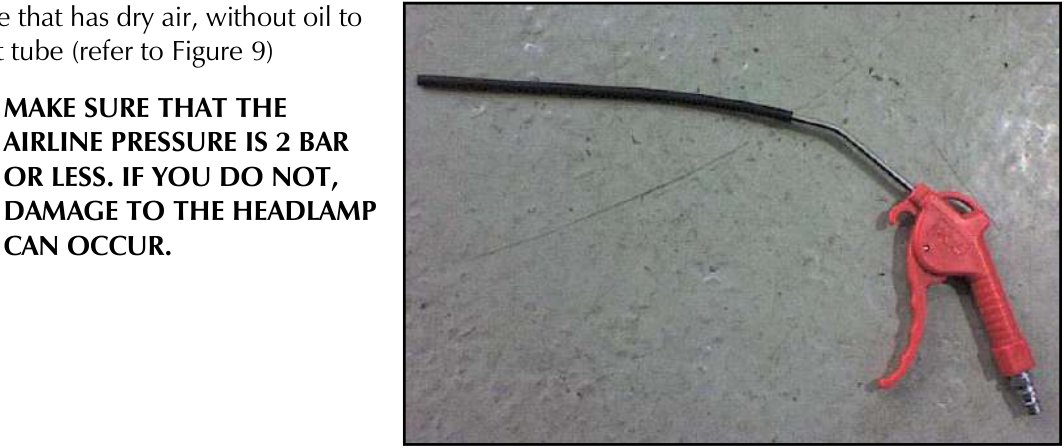 Red air hose with trigger nozzle lying on concrete floor