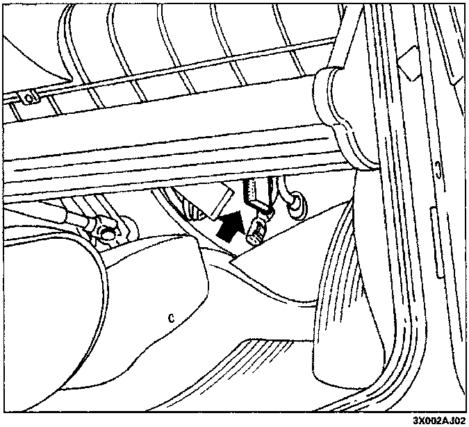 View of the passenger compartment under the oddments pocket showing the location of the diagnostic socket indicated by an arrow.