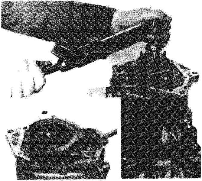 Two images showing the tightening of ring nuts on the 5th speed gear assembly using a torque wrench.