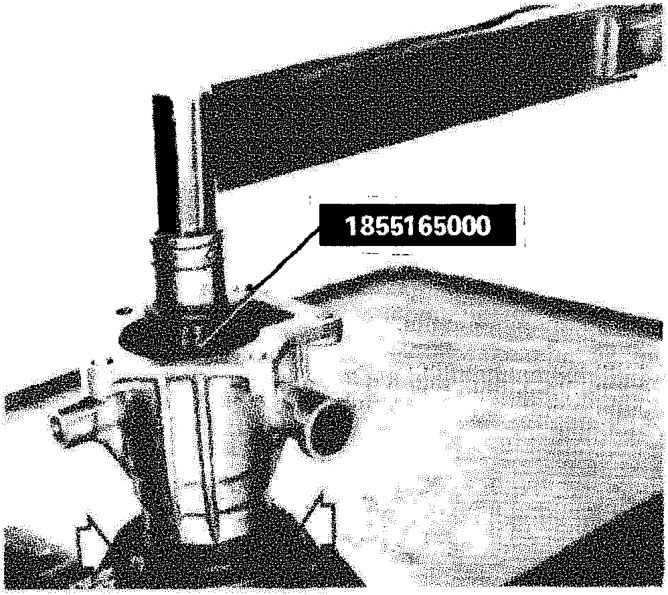 Ring nut on rear transmission power output shaft being tightened with a torque wrench
