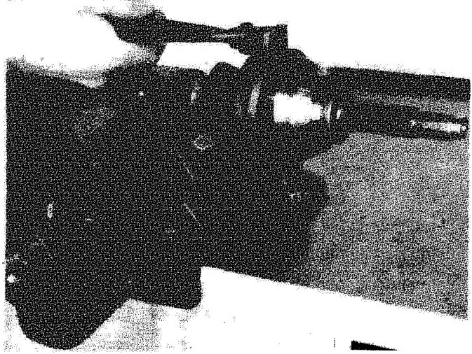 A close-up view of a constant velocity joint being fitted with a boot