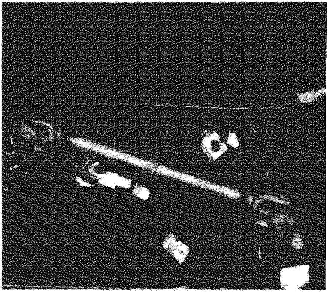 View of the brake pedal assembly and push rod under the dashboard