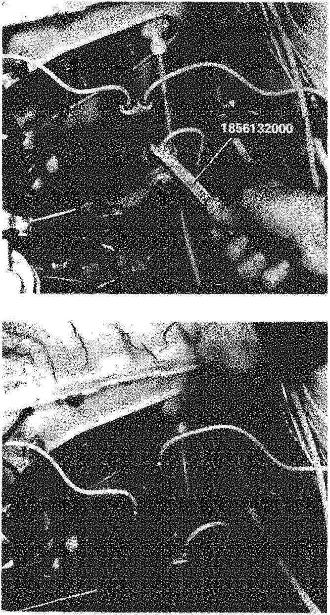 View of the master cylinder and connected brake pipes in the engine compartment.