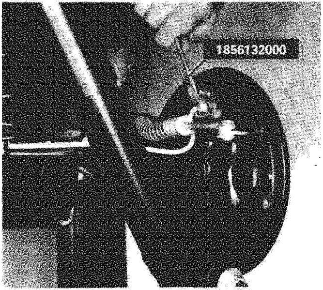 Rear brake assembly showing the flexible hose connection to the rigid pipe