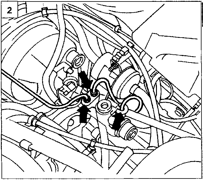 Diagram showing connectors for rigid brake pipes being undone on the brake servo assembly