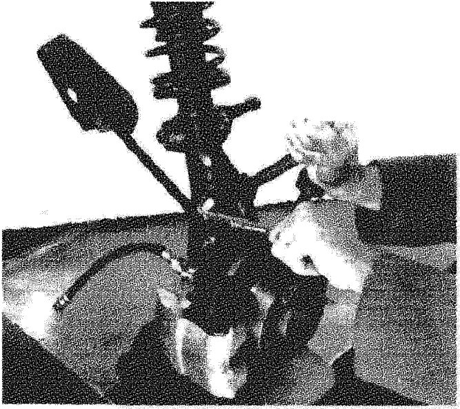 Removing-refitting shock absorber and spring from steering knuckle