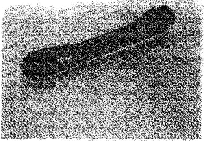 A black reaction rod with flexible bushes at each end