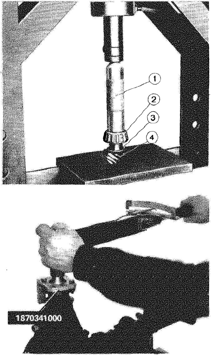 Press fitting the rear roller bearing inner track onto the bevel pinion using a drift and support ring