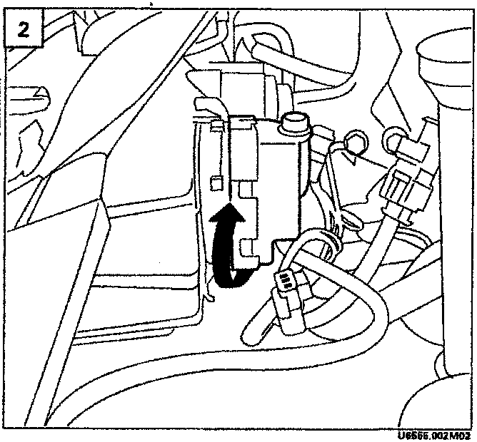 Illustrates removal of brake fluid reservoir cap with arrow indicating direction