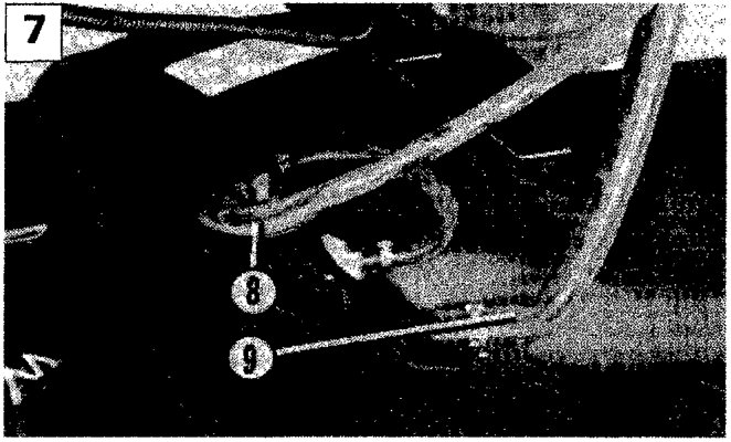 Image showing the underside of the vehicle with callout numbers 8 and 9 pointing to the anti-evaporation system pipes.