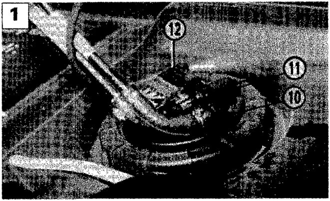 Diagram showing fuel return pipe (10), supply pipe (11), and multiple connector (12) at the top of the fuel tank assembly