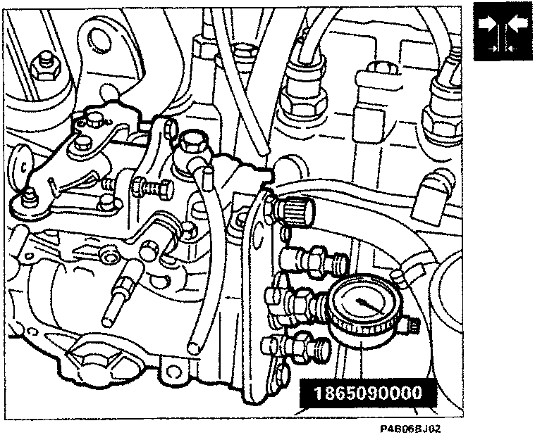 Diagram of injection pump with dial gauge attached, labeled 1865090000