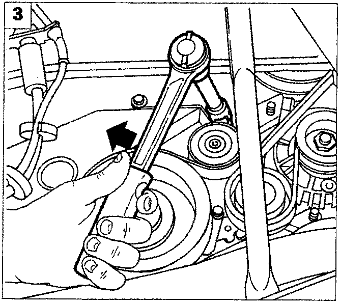 Close-up of the timing belt area being manipulated with a tool
