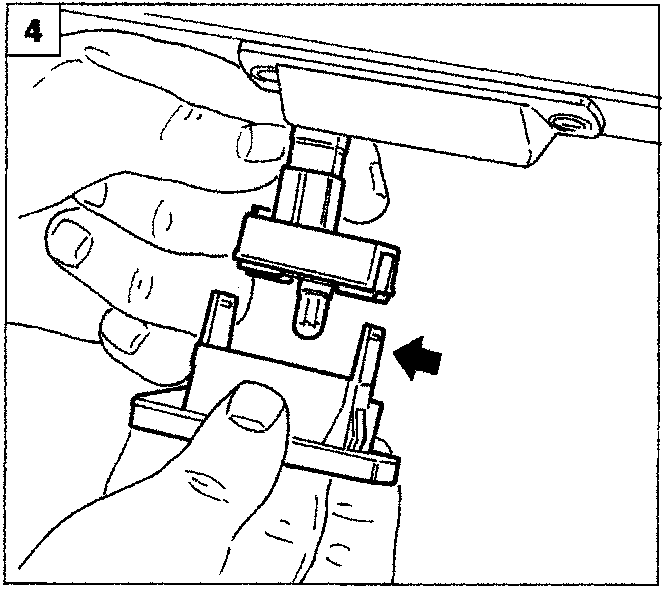 Diagram showing a hand withdrawing the bulb holder from the light frame by releasing the lugs