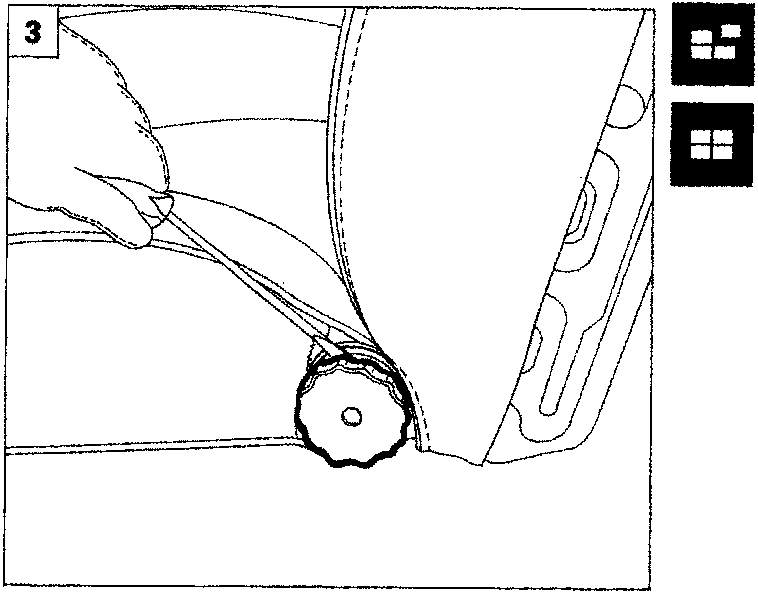 Hand turning a circular adjustment knob on the side of a seat backrest