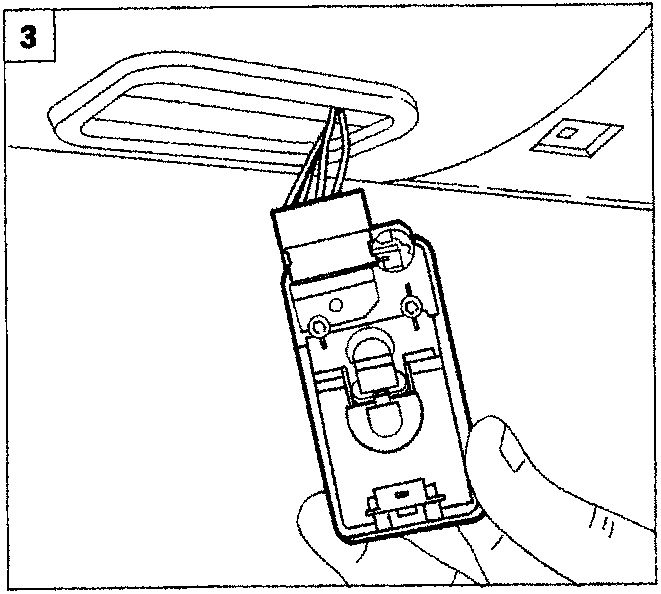 Diagram showing a hand removing the courtesy light assembly