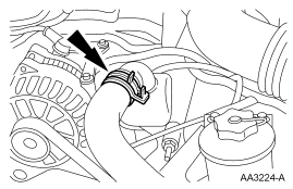 Step 21: Disconnect the upper radiator hose from the hose connection. Secure the hose to the radiator assembly.