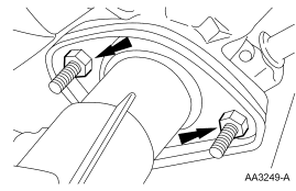Step 42: Support the exhaust and remove the 4 nuts.