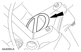 Step 52: Remove the torque converter nut access plug.