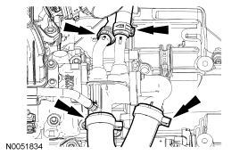 Step 15: Disconnect the upper radiator hose, lower radiator hose and 2 heater hoses from the thermostat housing.