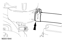 Step 22: Disconnect the hose from the power steering reservoir.