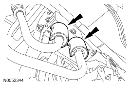 Step 34: Remove the 2 secondary latches from the transmission fluid cooler tubes.