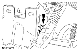 Step 16: Detach the wiring harness retainer from the transaxle control cable bracket.