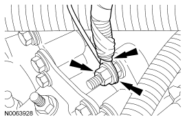 Step 29: Remove the nut, the ground wire and the radio interference capacitor wire from the engine front cover stud.