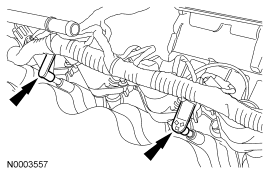 Step 11: Disconnect the 2 engine wiring harness retainers from the RH valve cover studs.