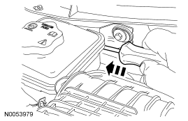 Step 30: Using a small screwdriver, release the retaining clip and detach the power steering reservoir from the cowl.