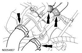 Step 15: Disconnect the upper radiator hose, lower radiator hose and 2 heater hoses from the thermostat housing.