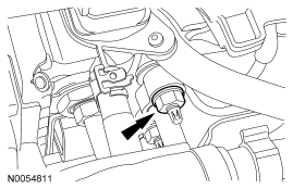 Step 21: Remove the nut and disconnect the A/C tube from the condenser.