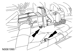 Step 25: Detach the 2 wiring harness retainers.