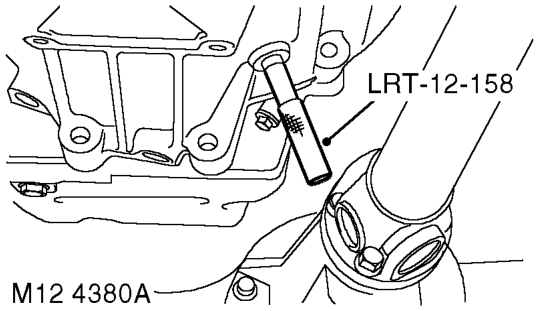 Position tool LRT-12-058 through camshaft carrier to lock camshaft.