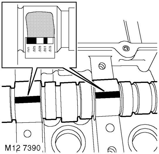 camshaft carrier retaining bolts. Do not discard bolts at this stage.