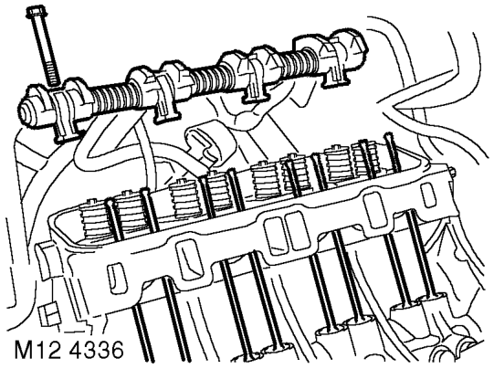 Remove 8 bolts securing exhaust manifold to cylinder head, release manifold and collect 2 