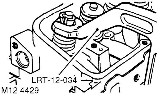 Disassembly – Loosen screw on tool LRT-12-034.