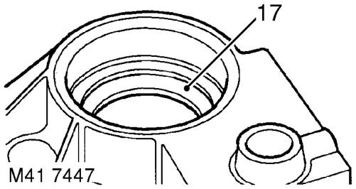 Support housing and drift out output shaft bearing. 20. Remove selector fork and shaft fro