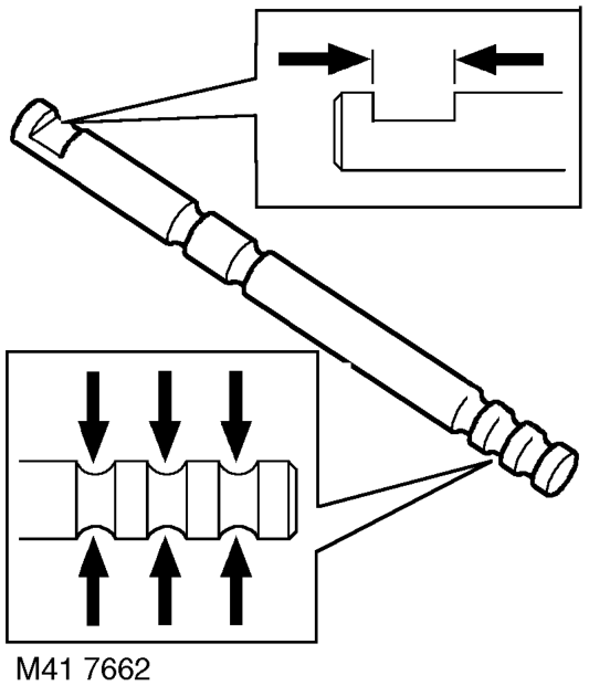 Compress high/low selector fork spring and remove retaining clips from each end of spring,