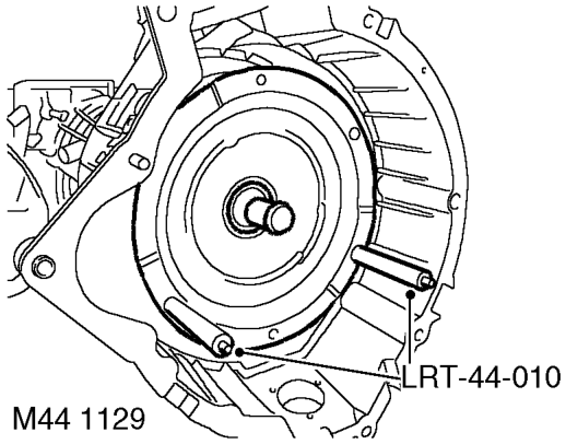 Fit new seal into converter housing using tool LRT-44-001.