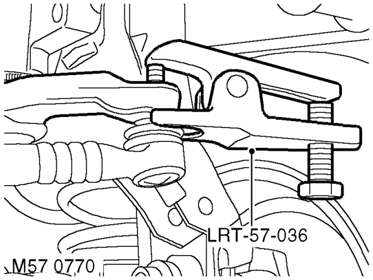 Remove securing nut and bolt and release Panhard rod.